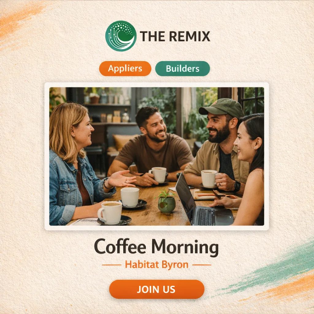 Four diverse professionals smiling and socializing around a wooden table with coffee cups during a networking event. A laptop and small plant are visible on the table.