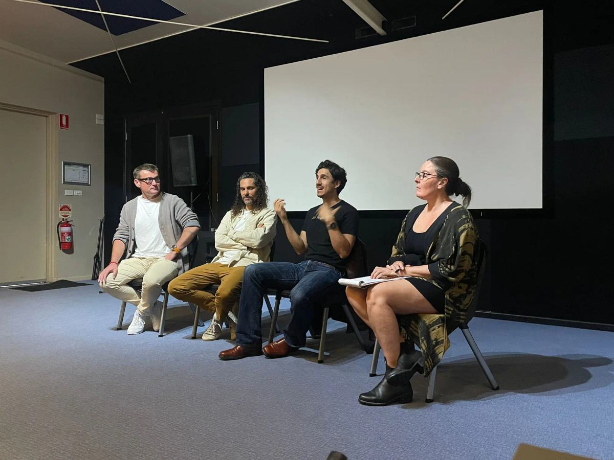Four speakers seated in conversation during the OpenAI to Byron event.